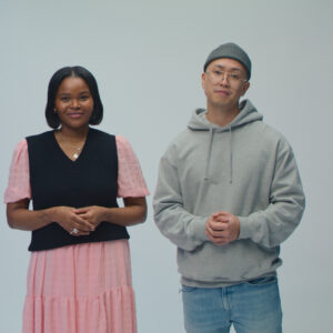 A young woman and young man stand for a photo