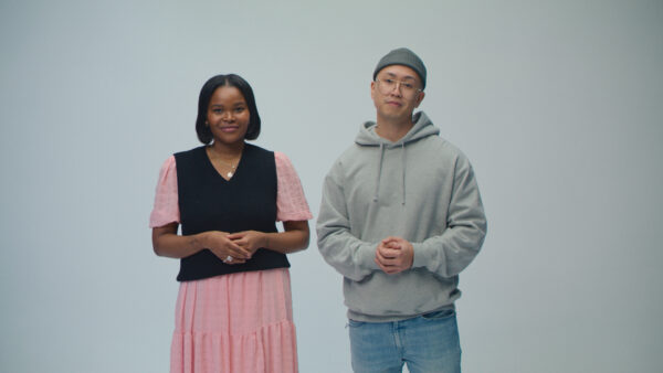 A young woman and young man stand for a photo